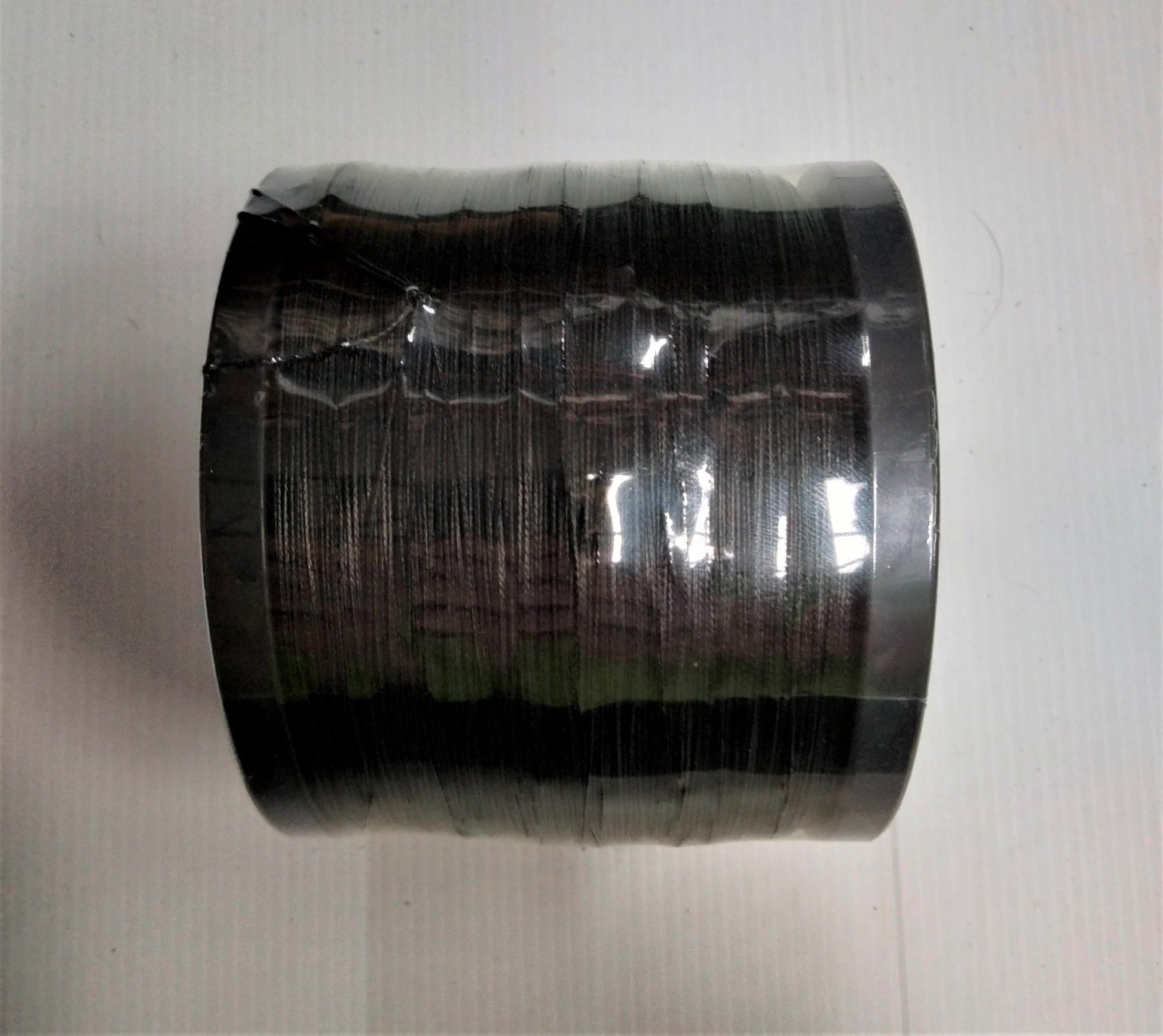 Sideview of spool of Seabraid commercial braid fishing line black 8 strand